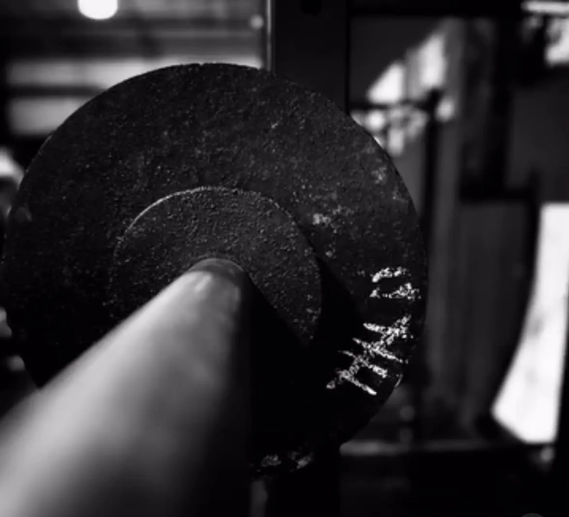 A loaded bar sleeve, the knurling worn bright